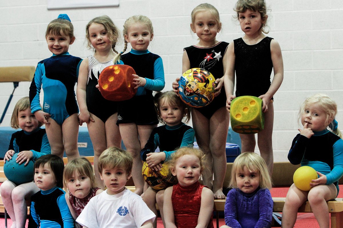 pre-school gymnasts pose for a group photo