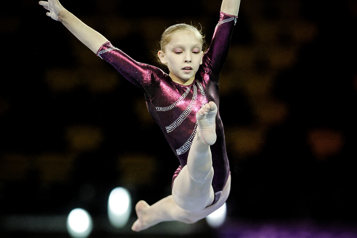young artistic gymnast in competition