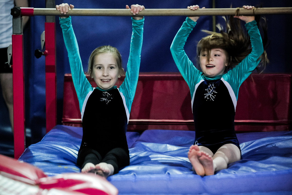 playtime on the bars for two young artistic gymnasts